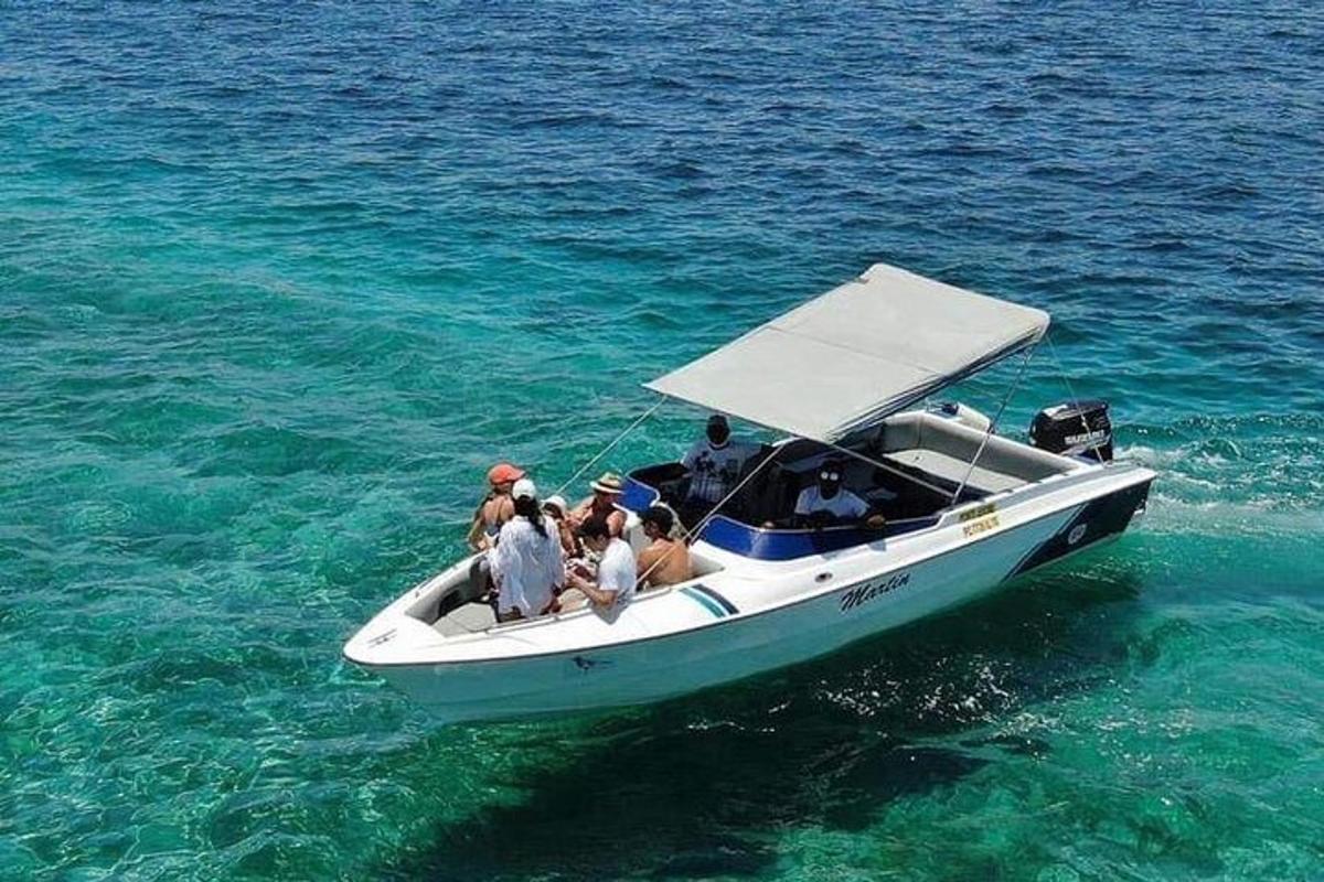 a group of people on a boat in the water