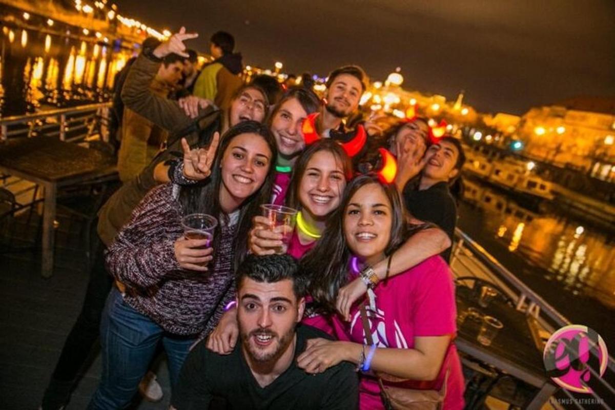 a group of people posing for a picture on a bridge