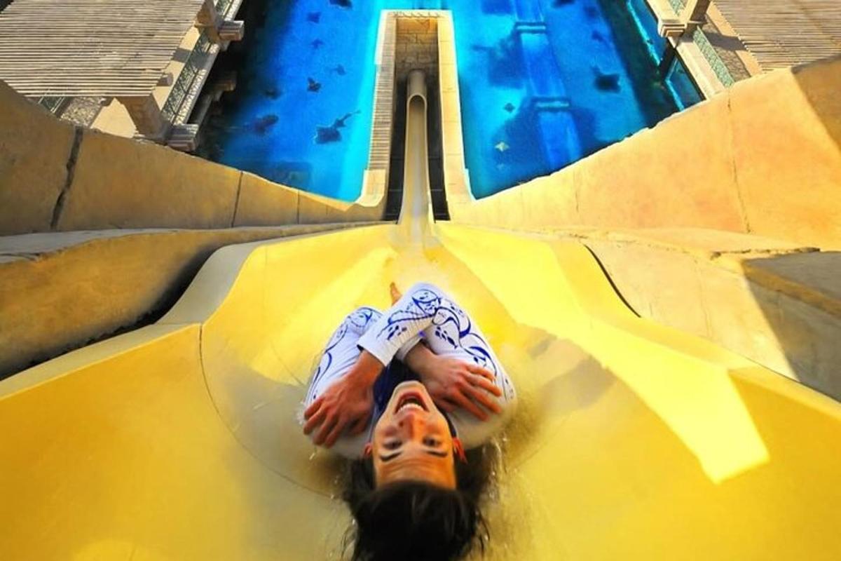 a person laying in the water in a pool