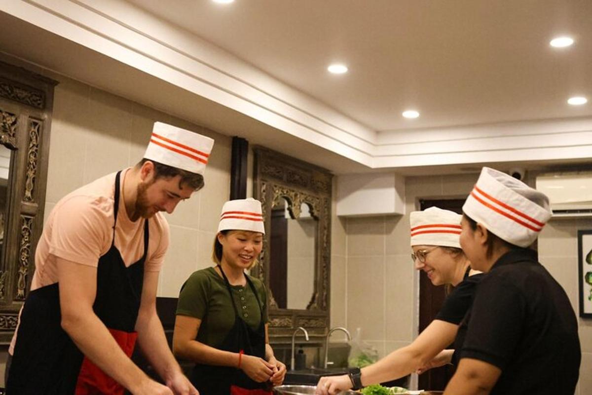 a group of people wearing chef hats in a kitchen