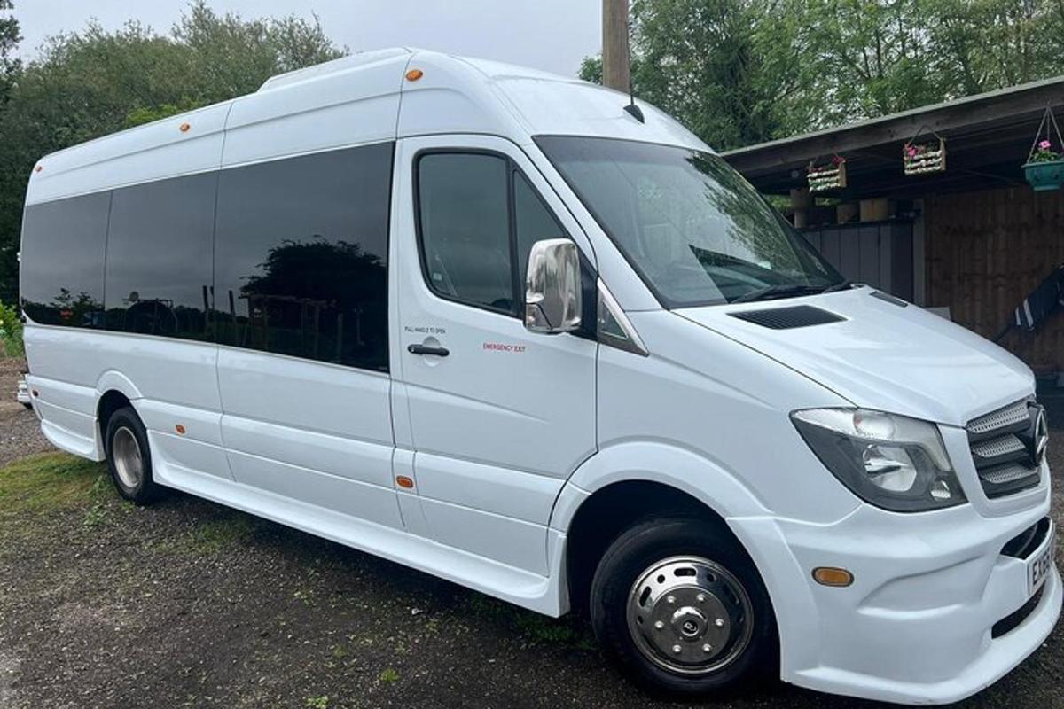 a white van parked in front of a building