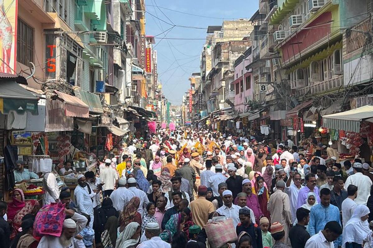 a large crowd of people walking down a busy street