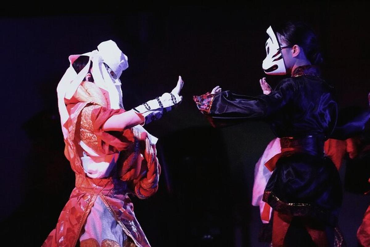 a couple of people in costume on a stage