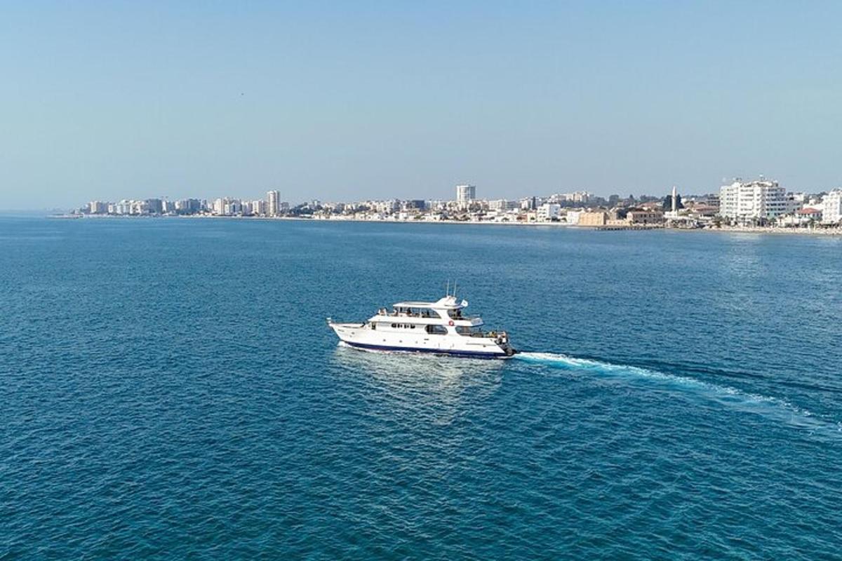 a boat in the water with a city in the background
