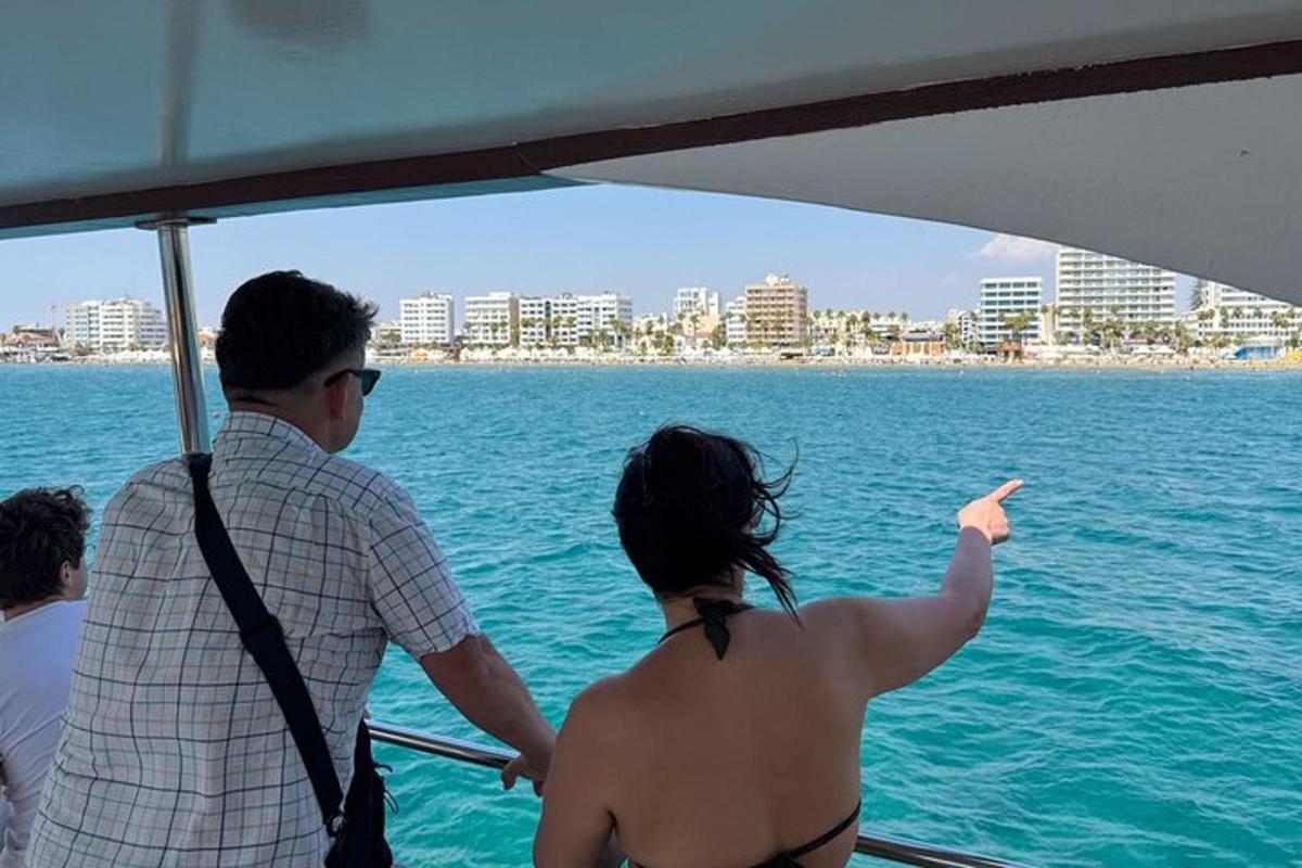 a man and woman on a boat in the water