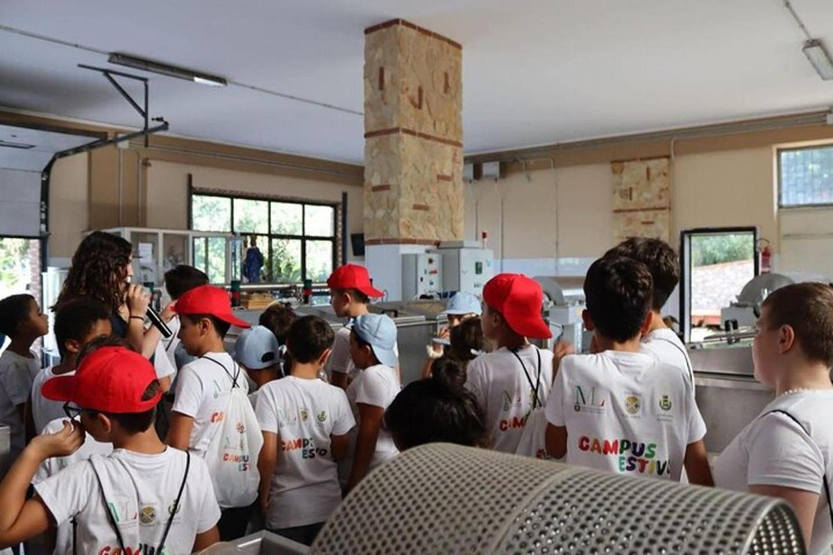 a group of children wearing red hats in a room