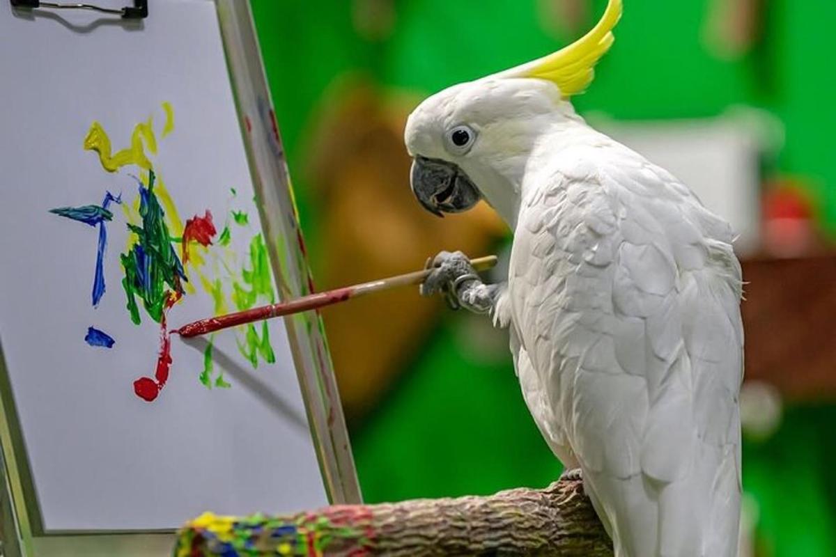 a white parrot sitting on a branch painting
