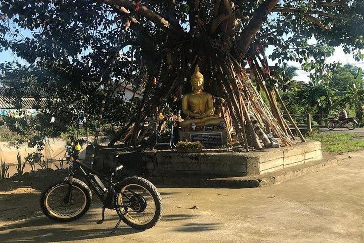 a bicycle is parked in front of a statue