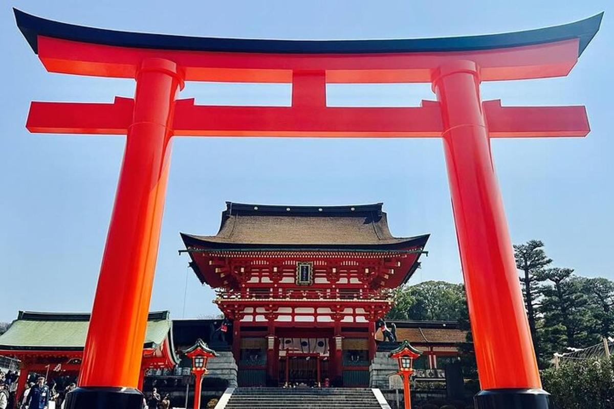 a red torii gate in front of a building
