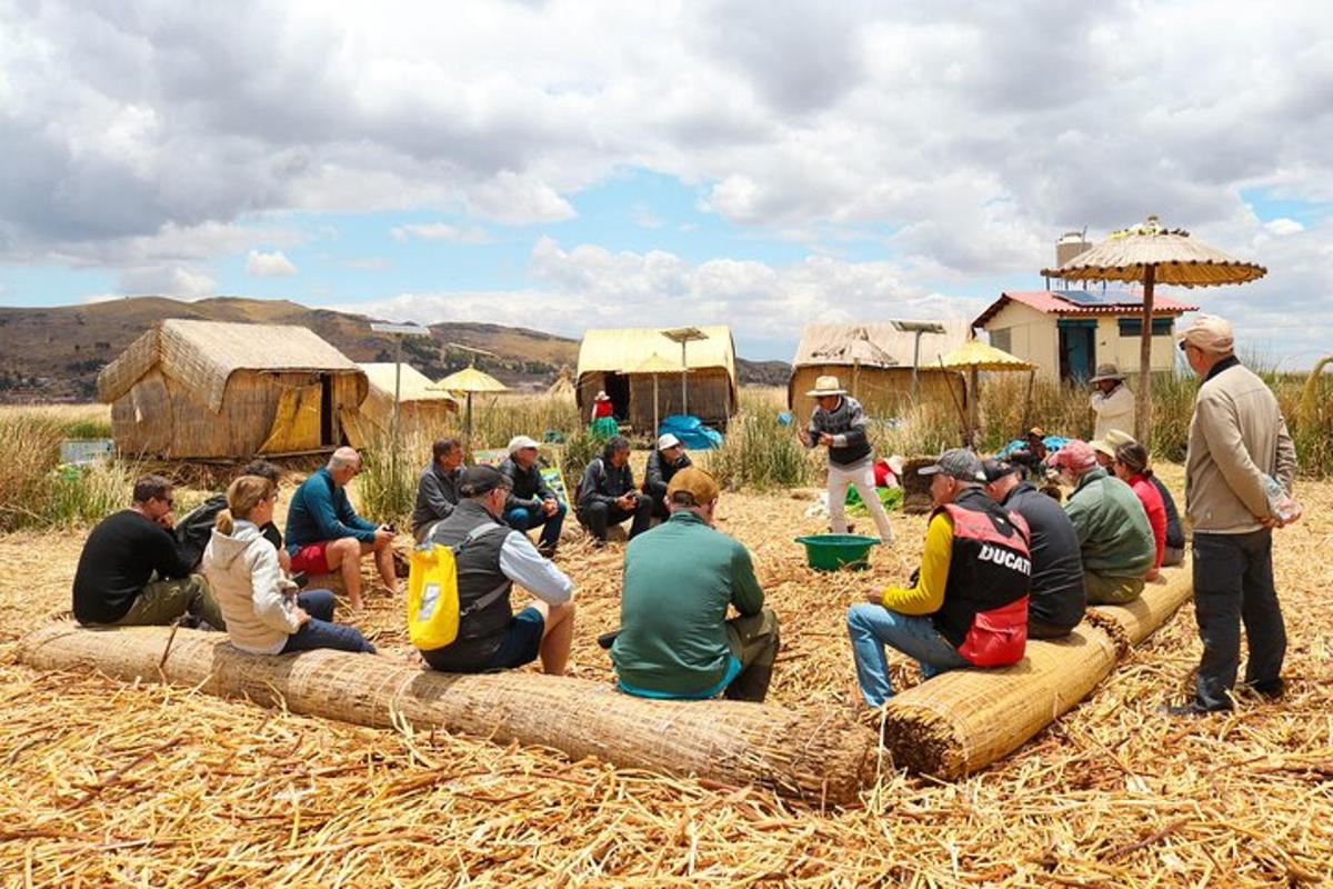 a group of people sitting on a log in a field