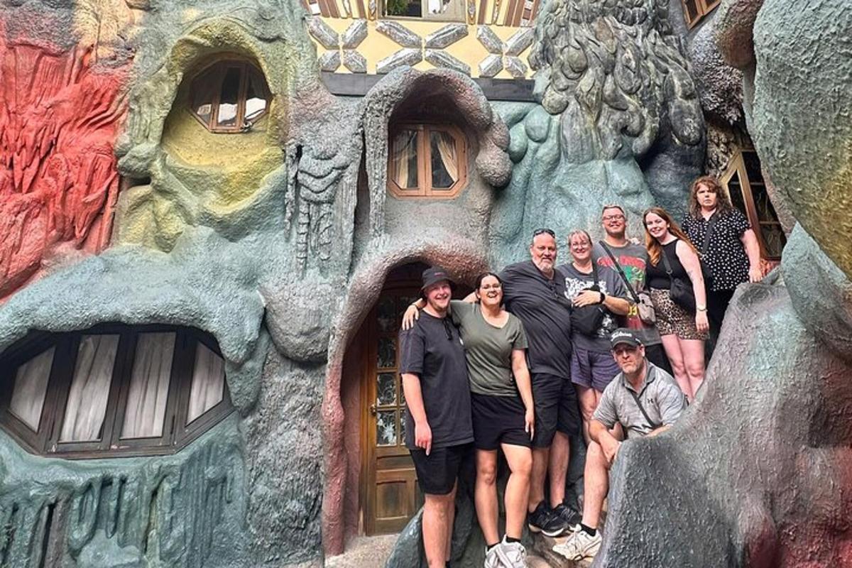 a group of people posing in front of a building