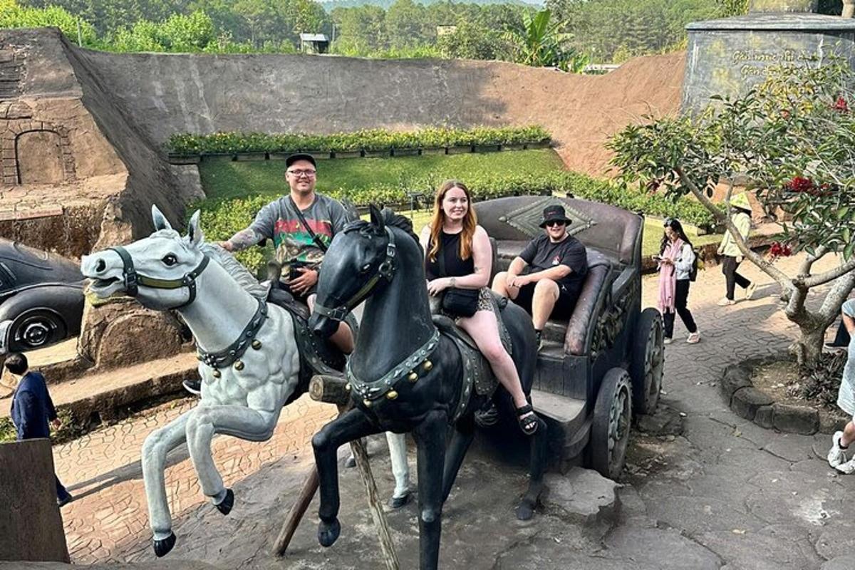 a group of people riding in a horse drawn carriage