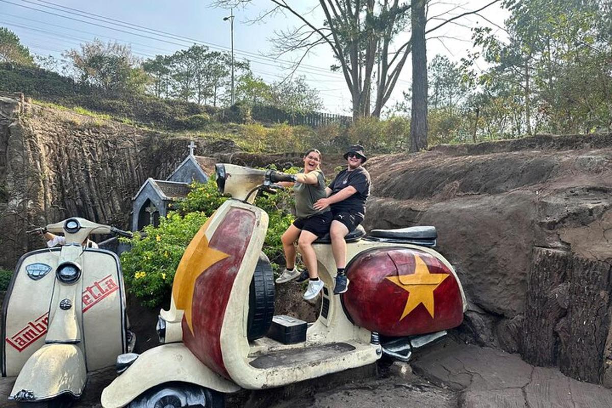 a man and a woman sitting on a scooter