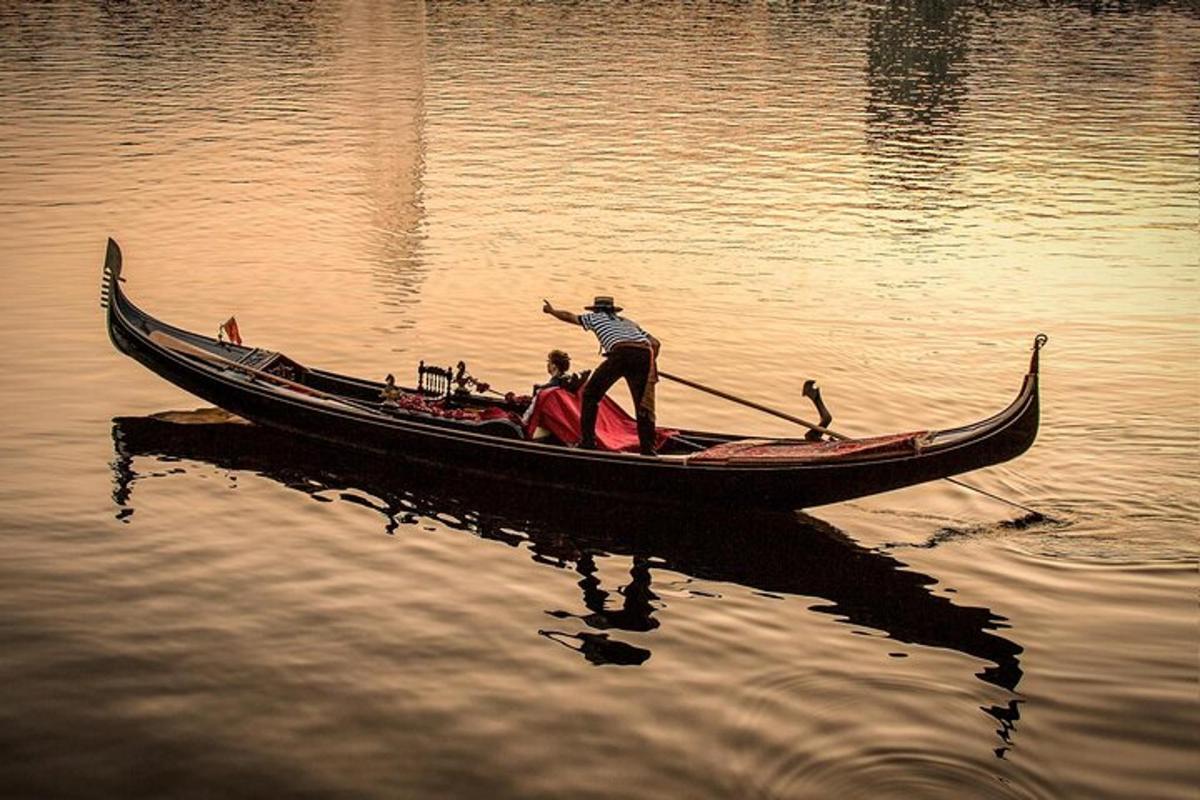 a group of people in a boat on the water