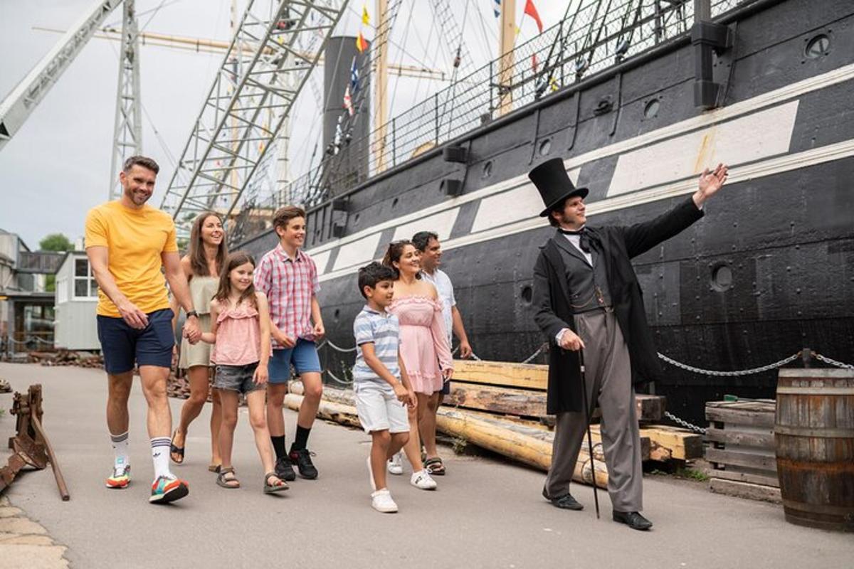 a group of people walking next to a ship