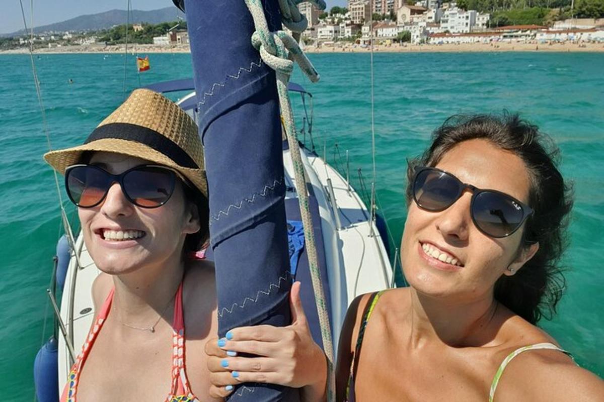 two women in sunglasses are on a boat in the water