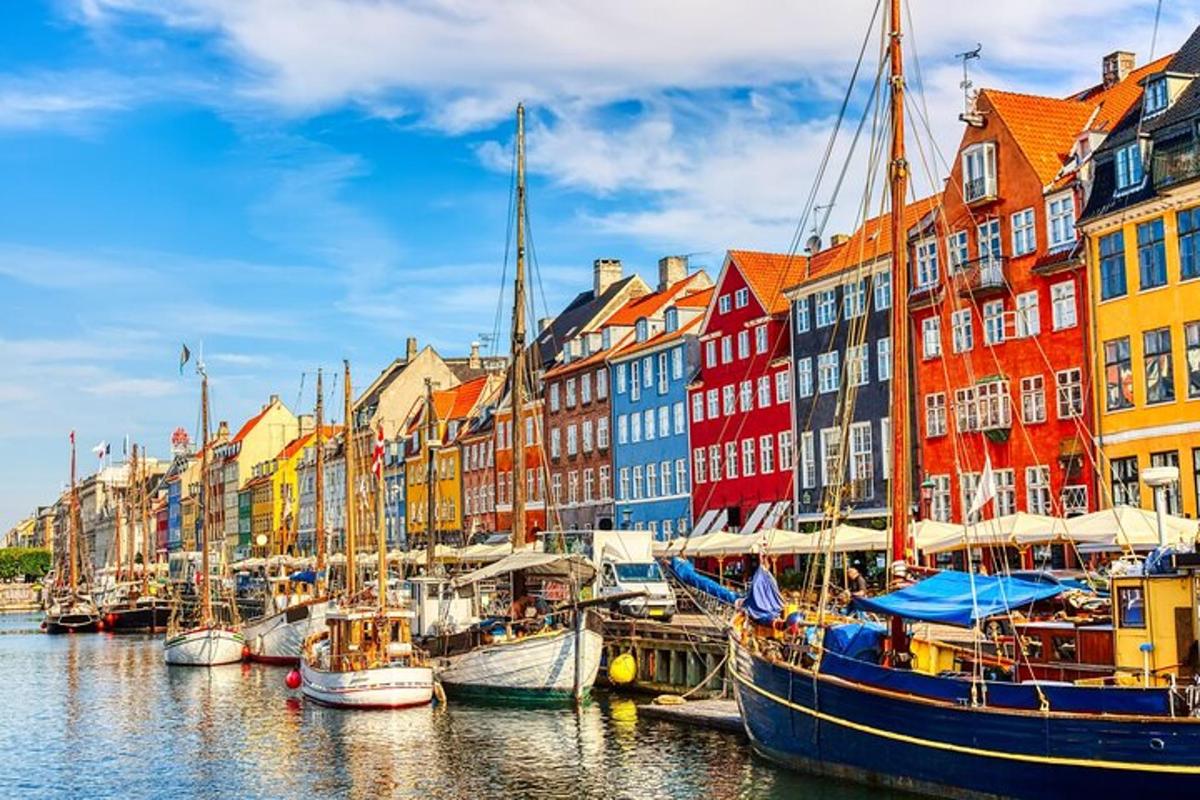 a group of boats docked in a harbor with buildings
