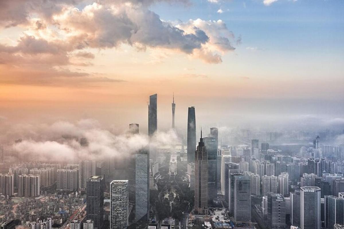 a foggy city with tall skyscrapers