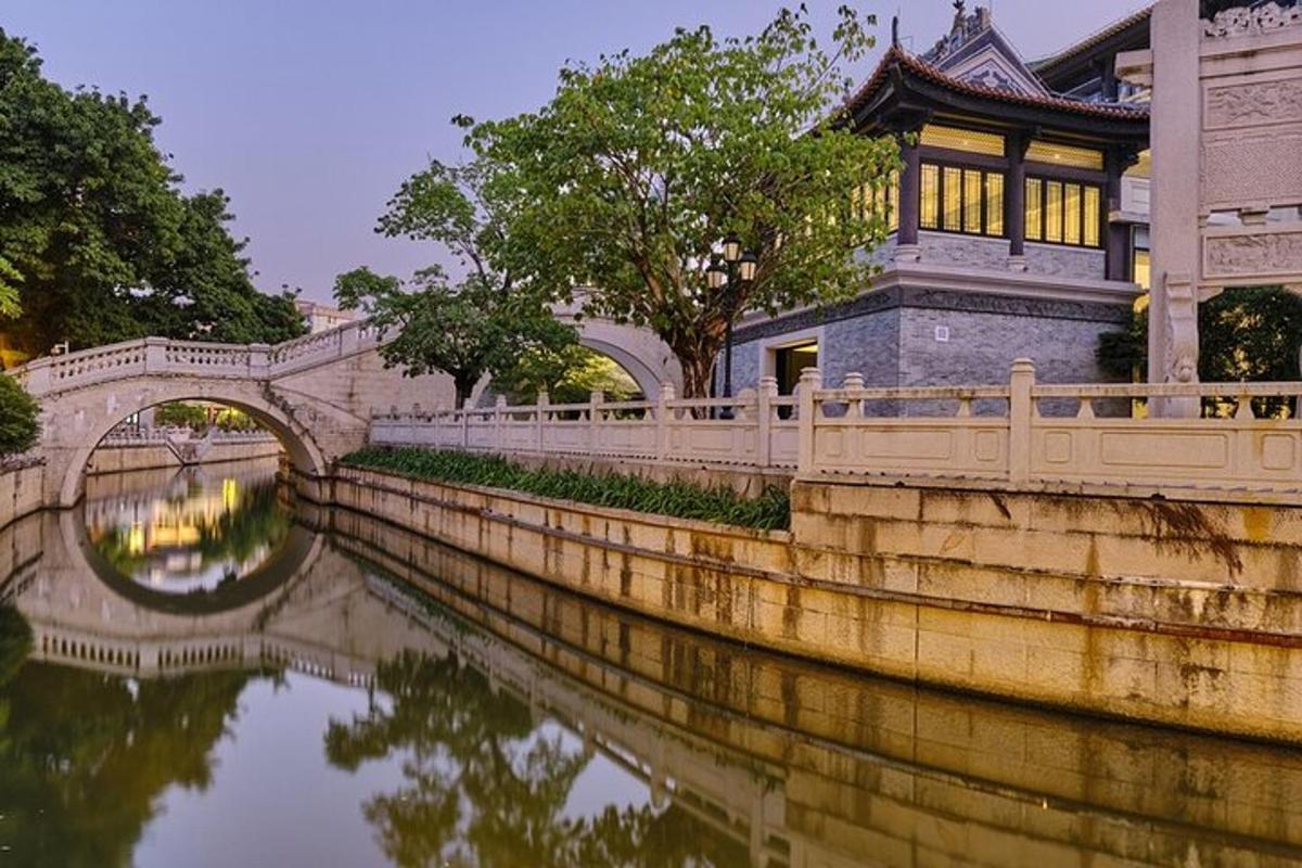 a bridge over a river next to a building
