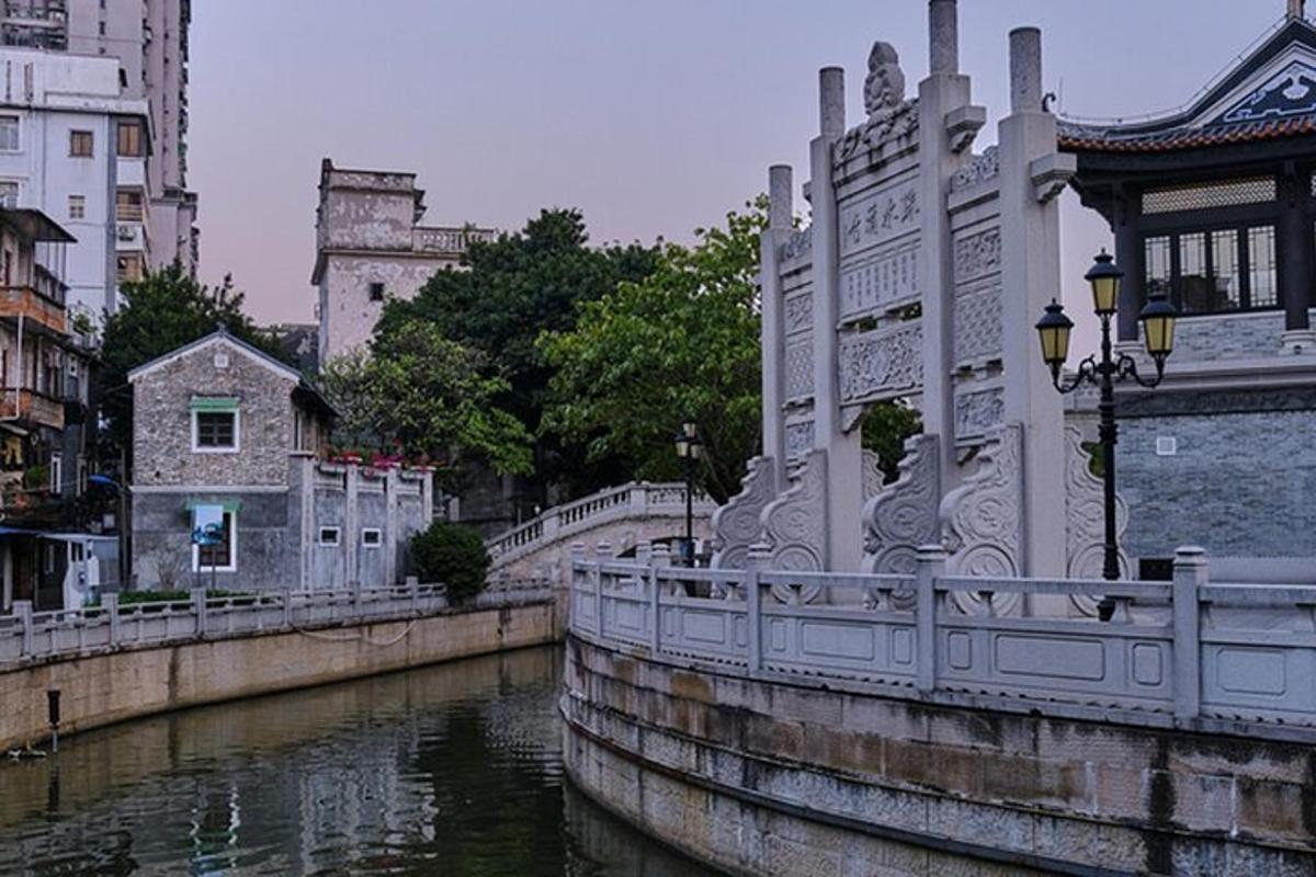 a bridge over a river in a city