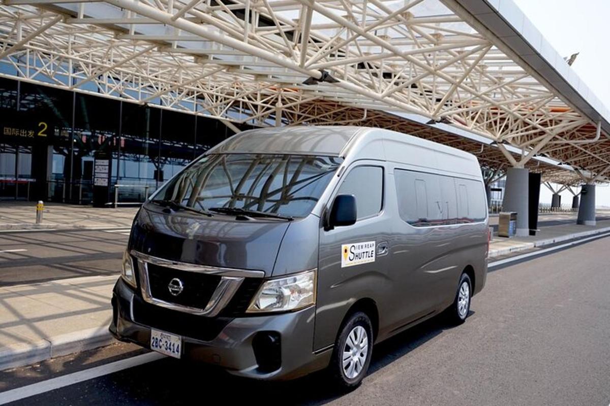 a silver van parked in a parking lot