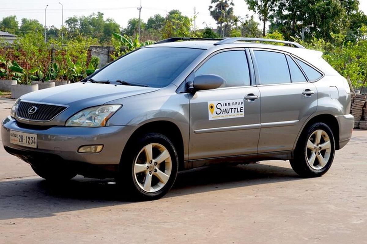 a silver suv with a climate shuttle sticker on it