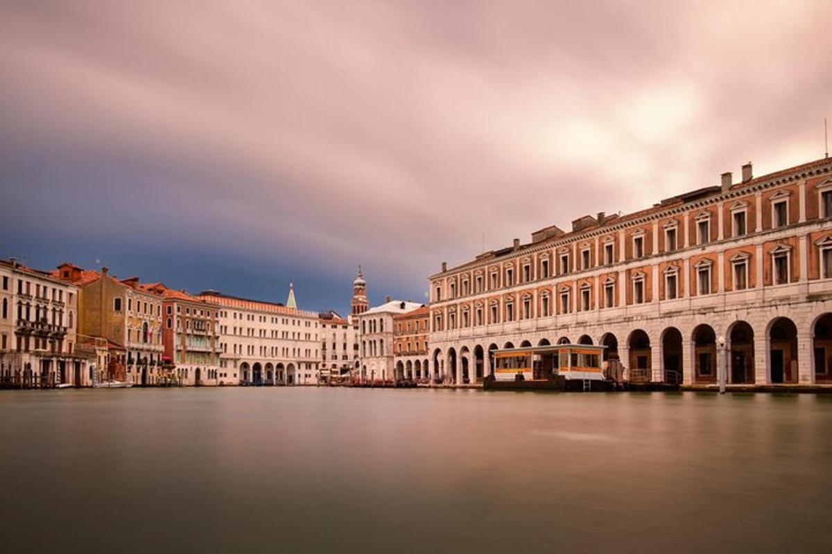 a group of buildings on the water in a city