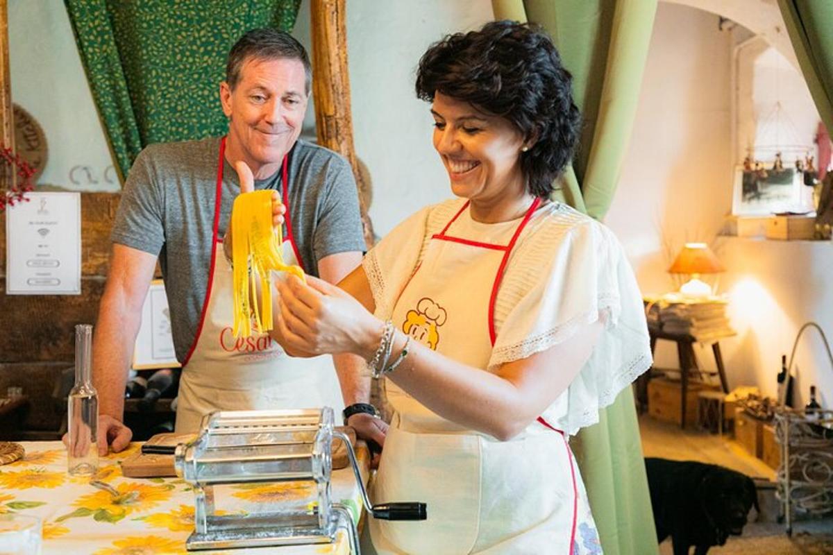 a man and a woman in a kitchen preparing food