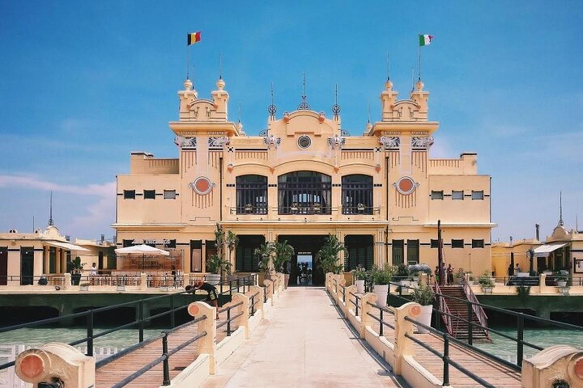 a large building with a bridge in front of it