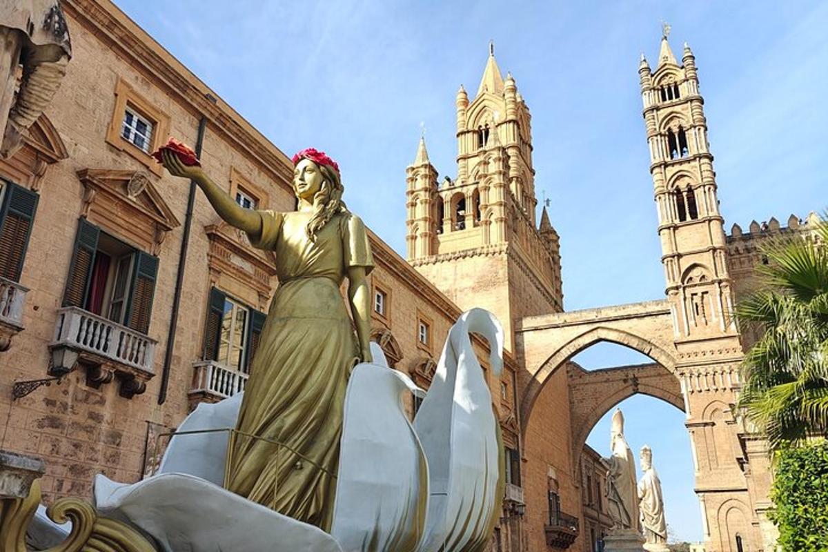 a statue of a woman standing in front of a building