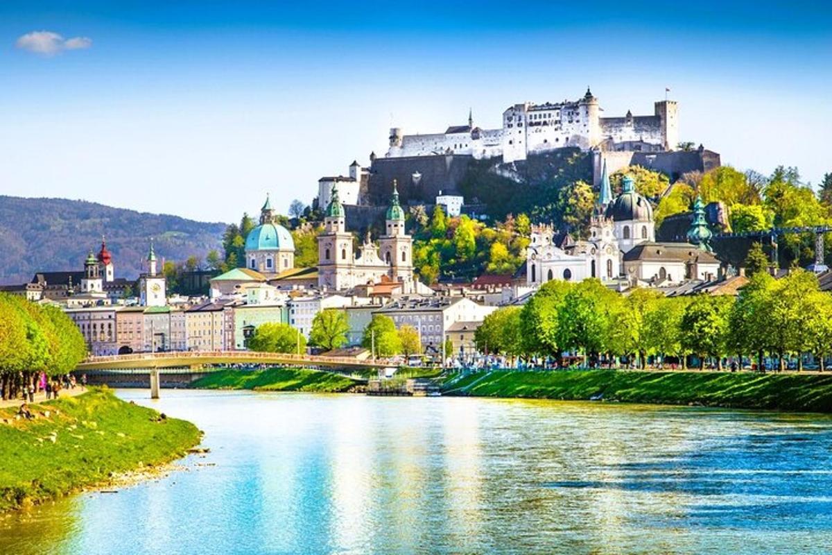 a view of a city with a river and a castle