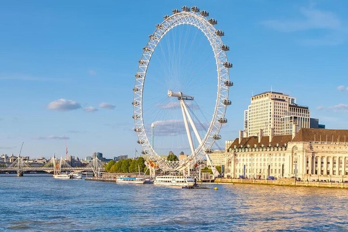 a large ferris wheel sitting on the water in a city