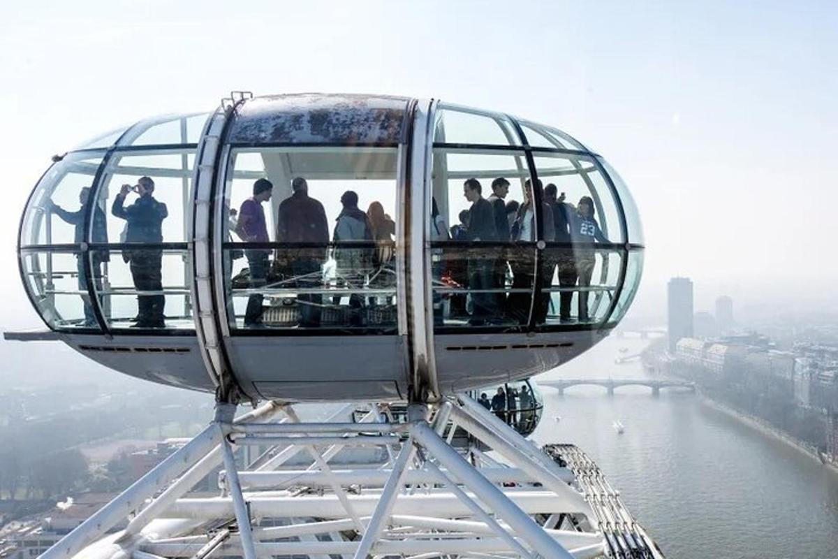 a group of people standing on the top of a coaster