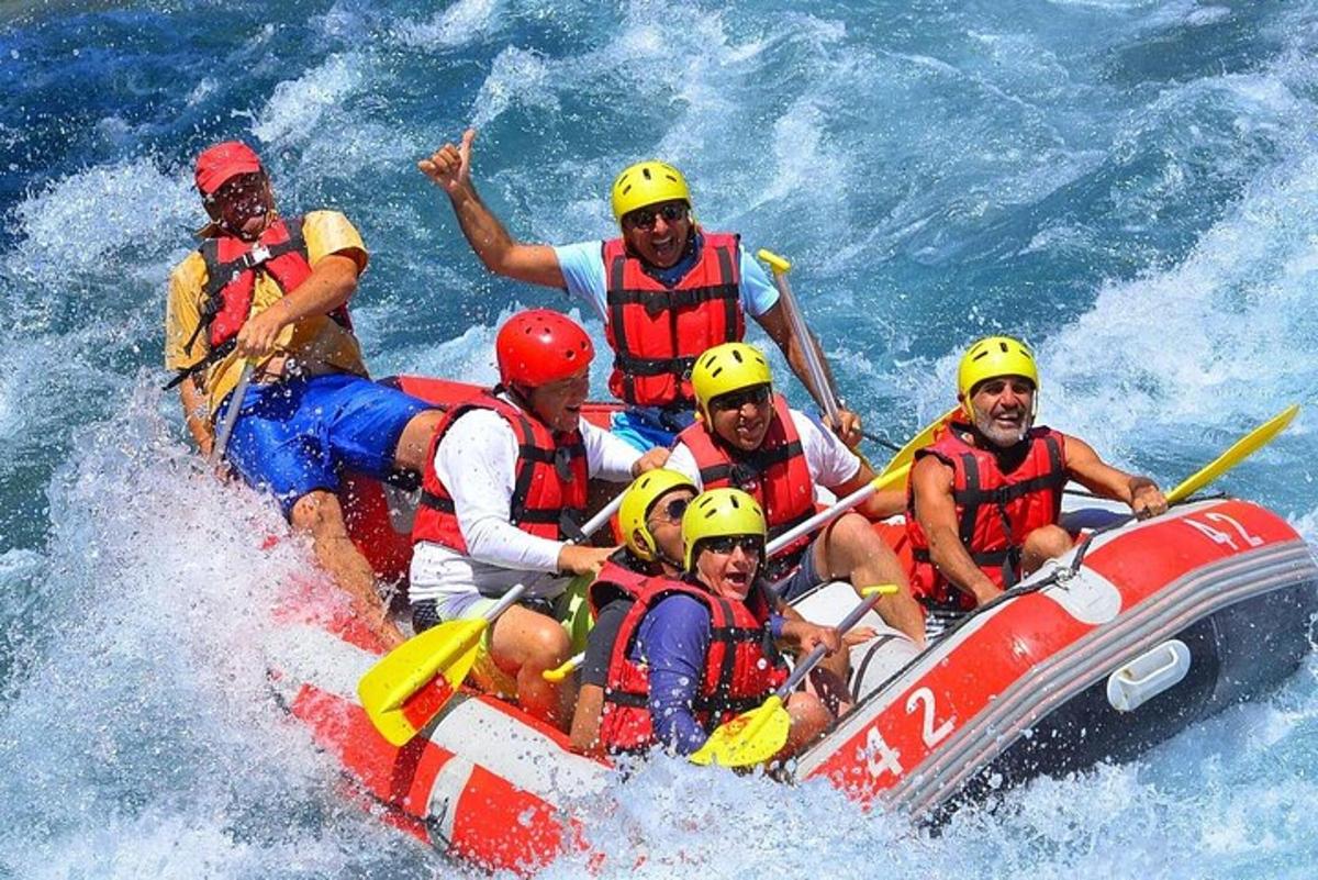 a group of people on a raft in the water