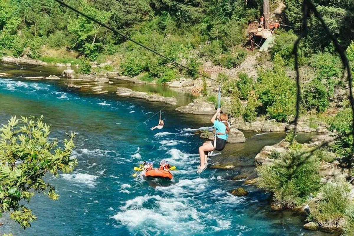 a woman on a rope swing in a river