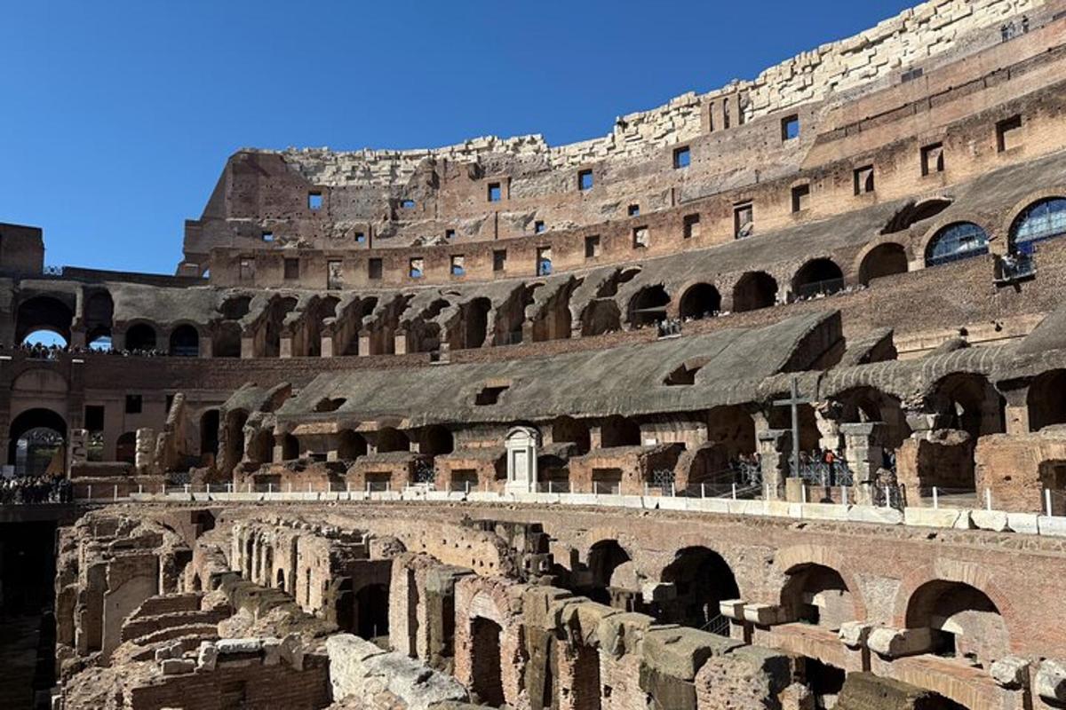 a large amphitheater with a building in the background