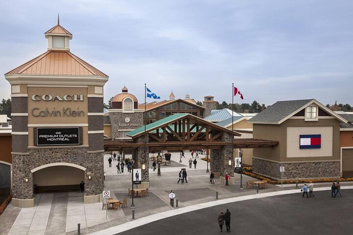 a group of people walking around a shopping mall