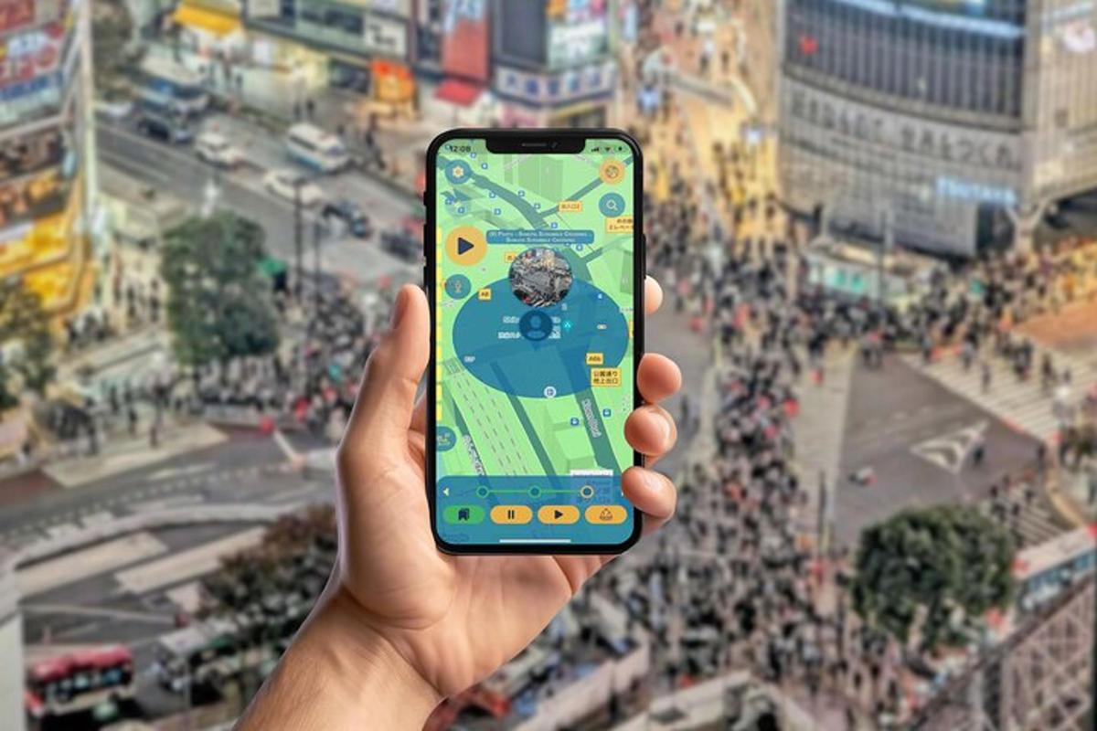 a person holding up a cell phone in a city