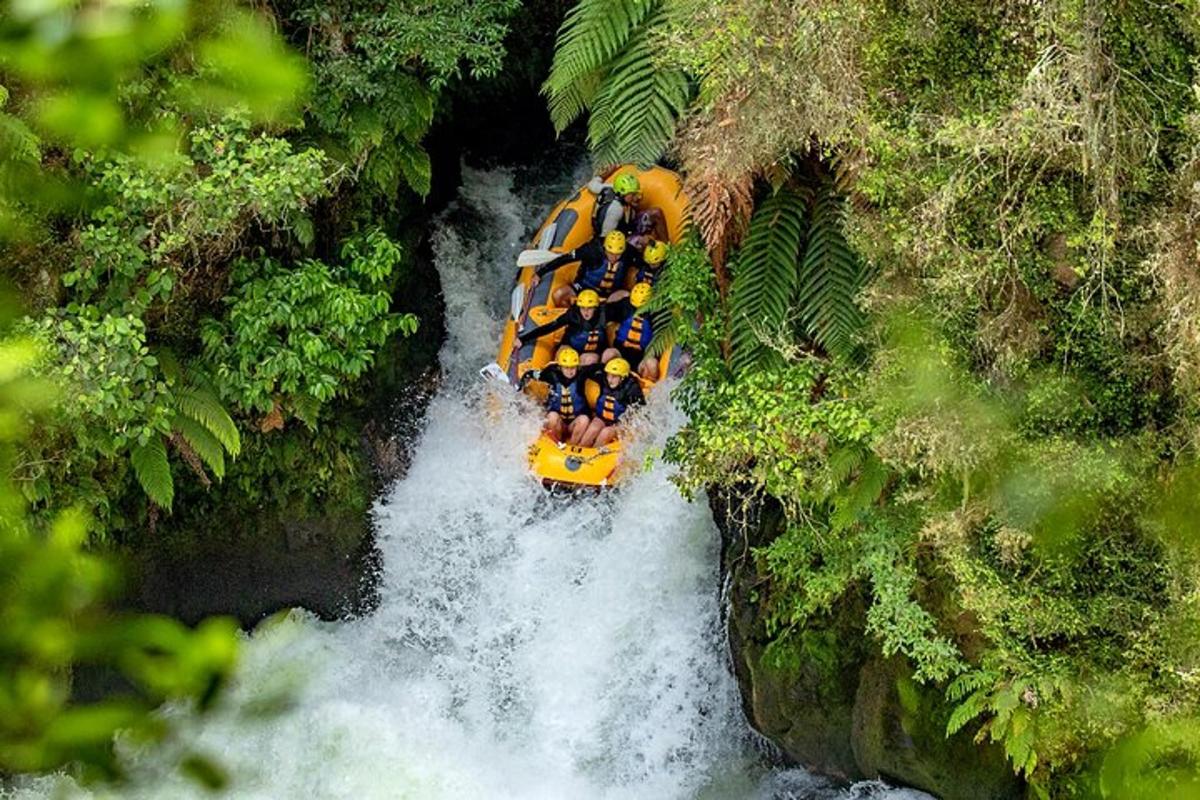 a group of people in a raft in a river
