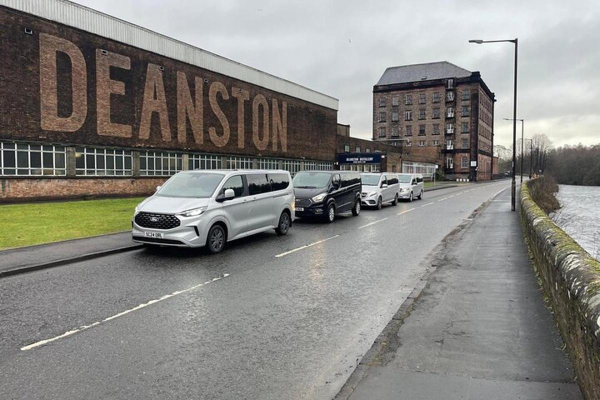 a row of cars parked on the side of a road