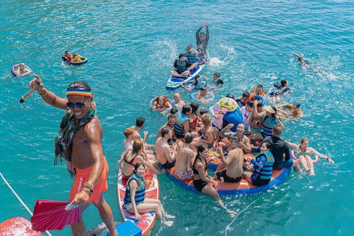 a group of people in the water on rafts