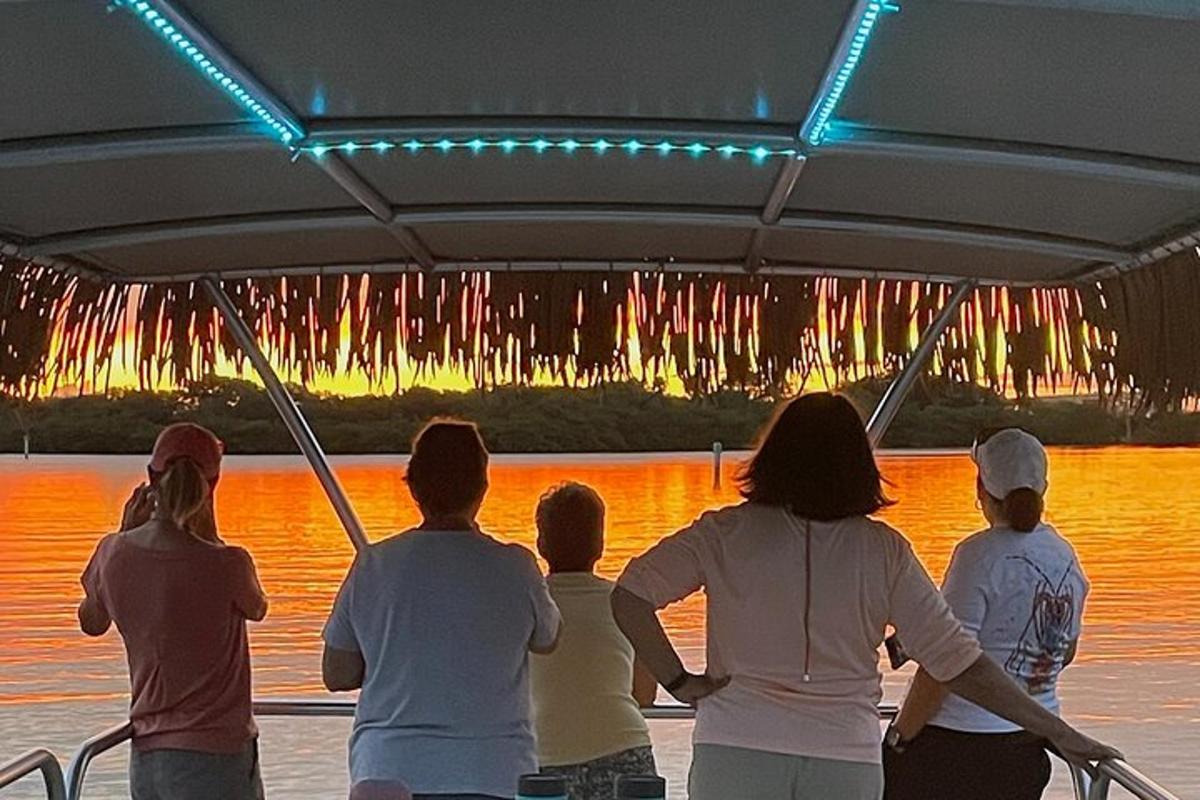 a group of people on a boat in the water