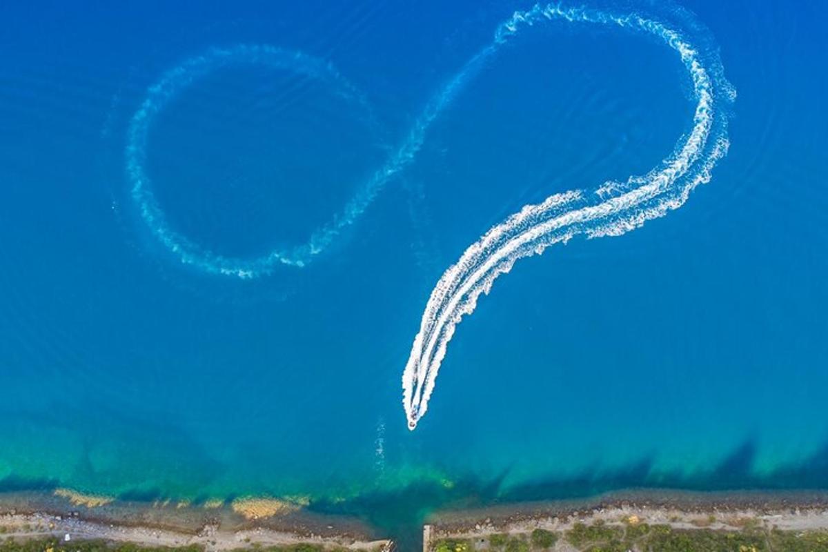 two trails of smoke in the blue sky