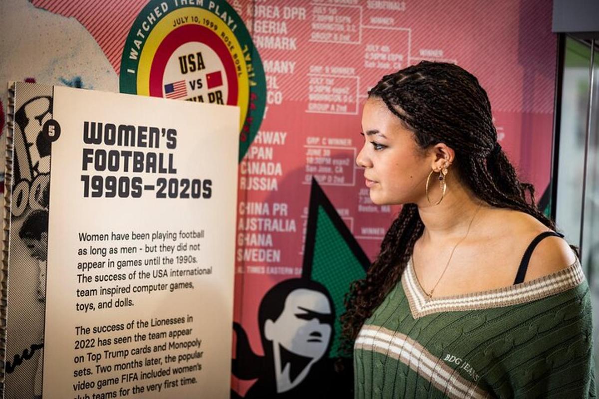 a woman standing in front of a sign