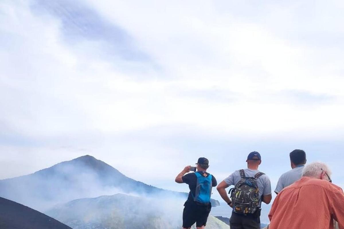 a group of people standing on top of a mountain