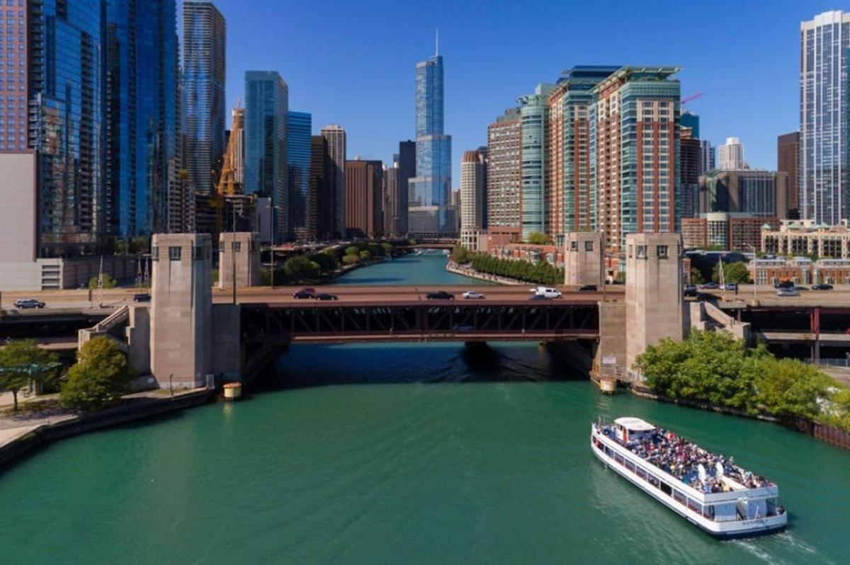 a boat in a river under a bridge