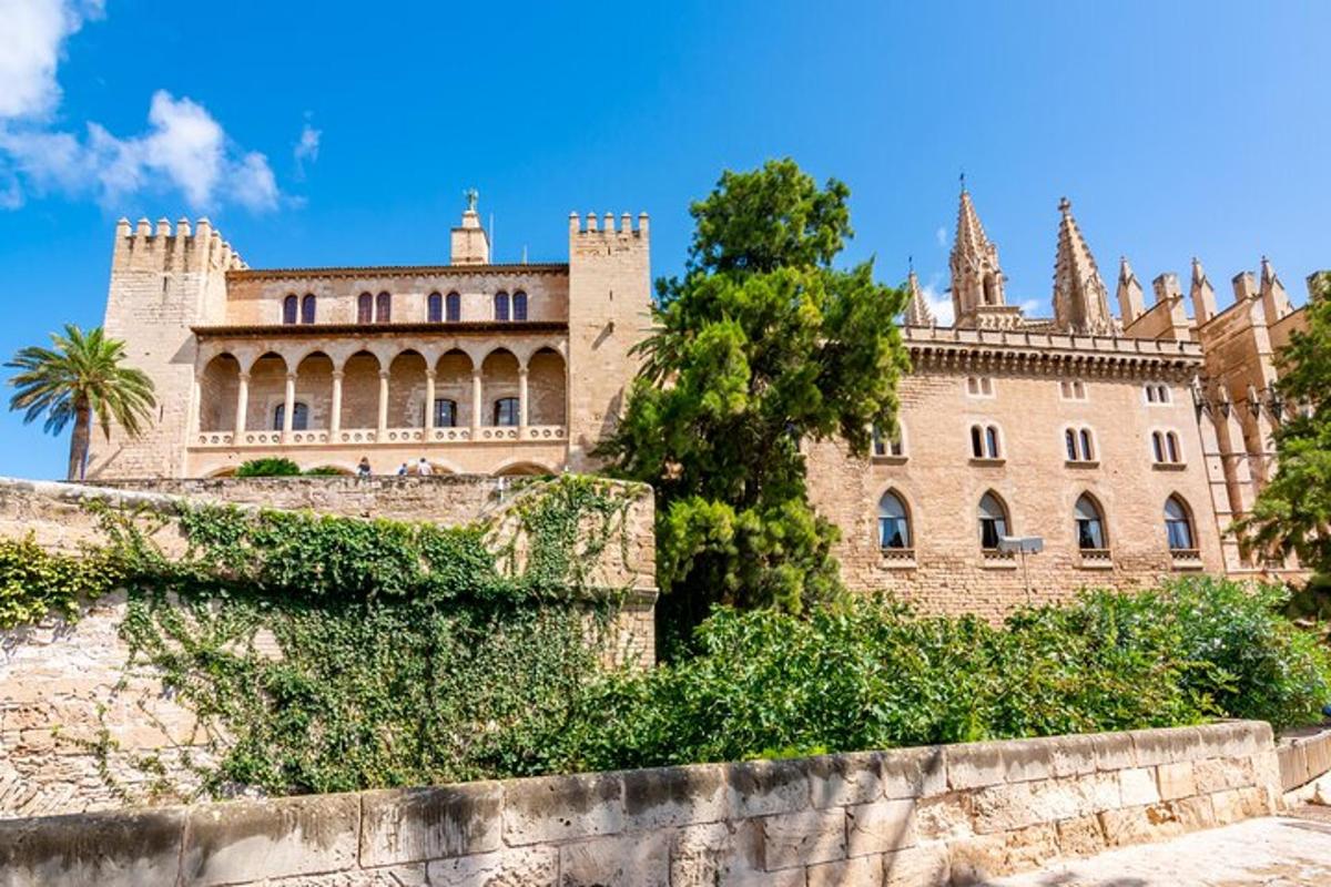 a large castle with a wall in front of it