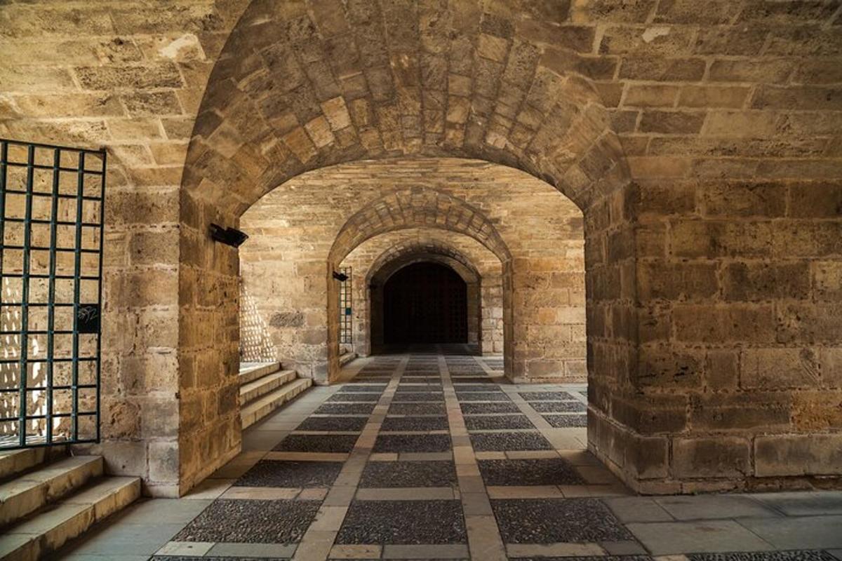 an archway in a stone building with a hallway