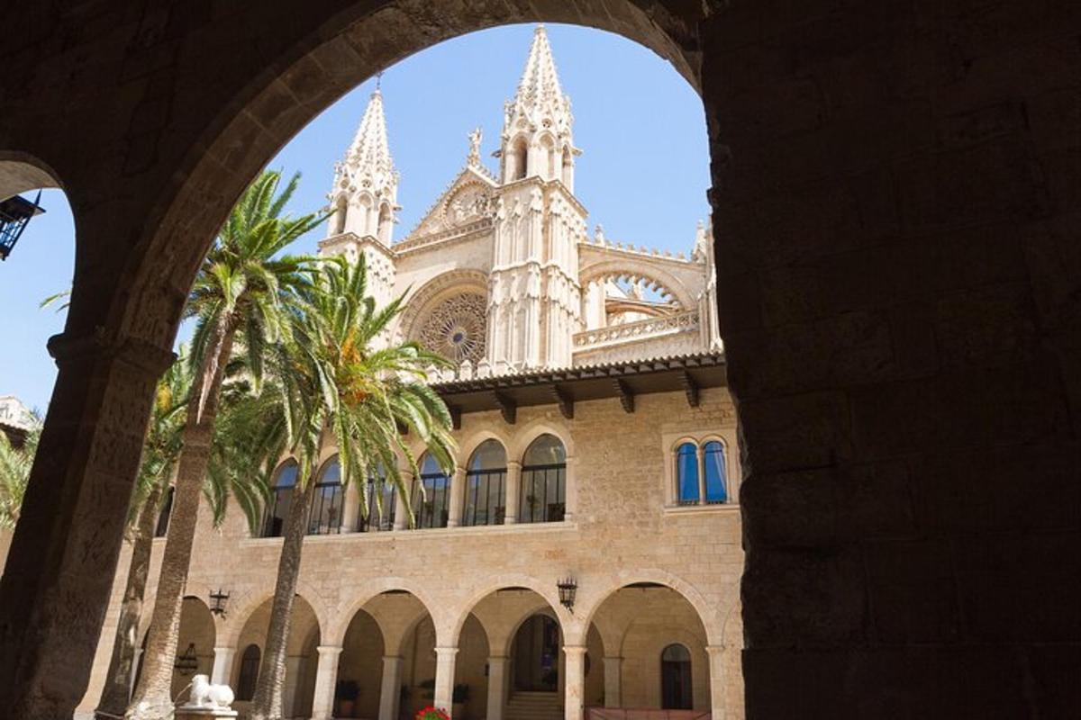 a large building with a palm tree in front of it