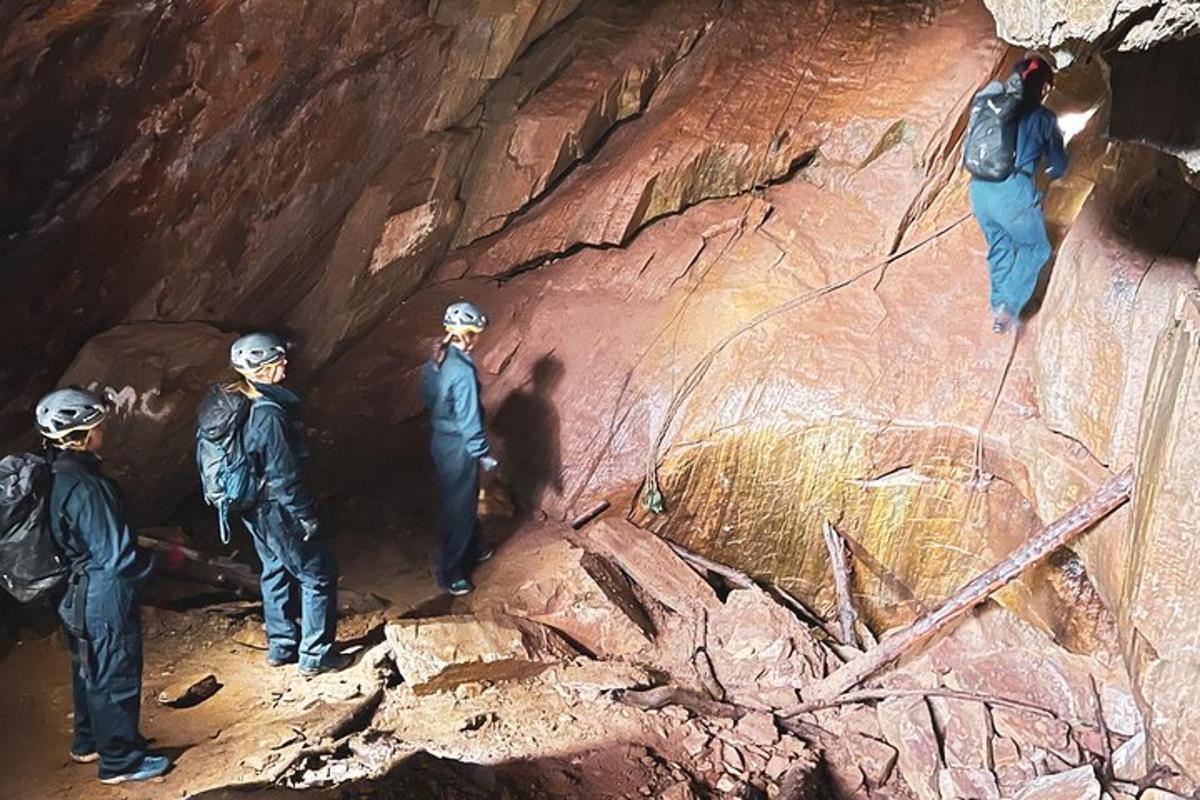 a group of people standing in a cave